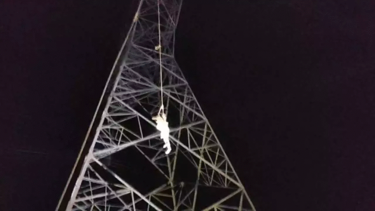 High voltage drama of a young man who climbed a high tension tower